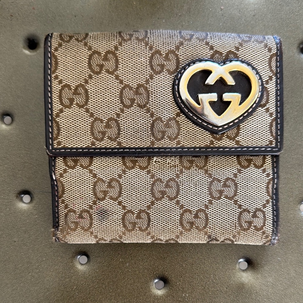 Authentic Gucci monogram Brown and Gold small snap wallet